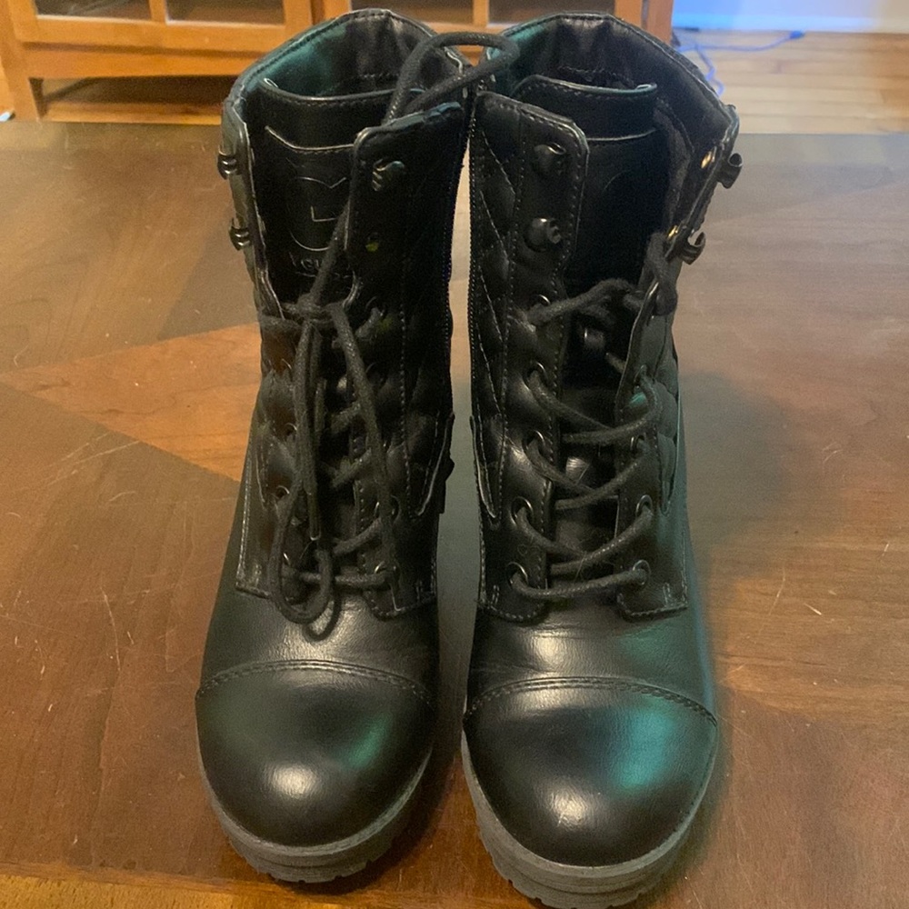 Brand is guess, all black leather boots, size 5.5